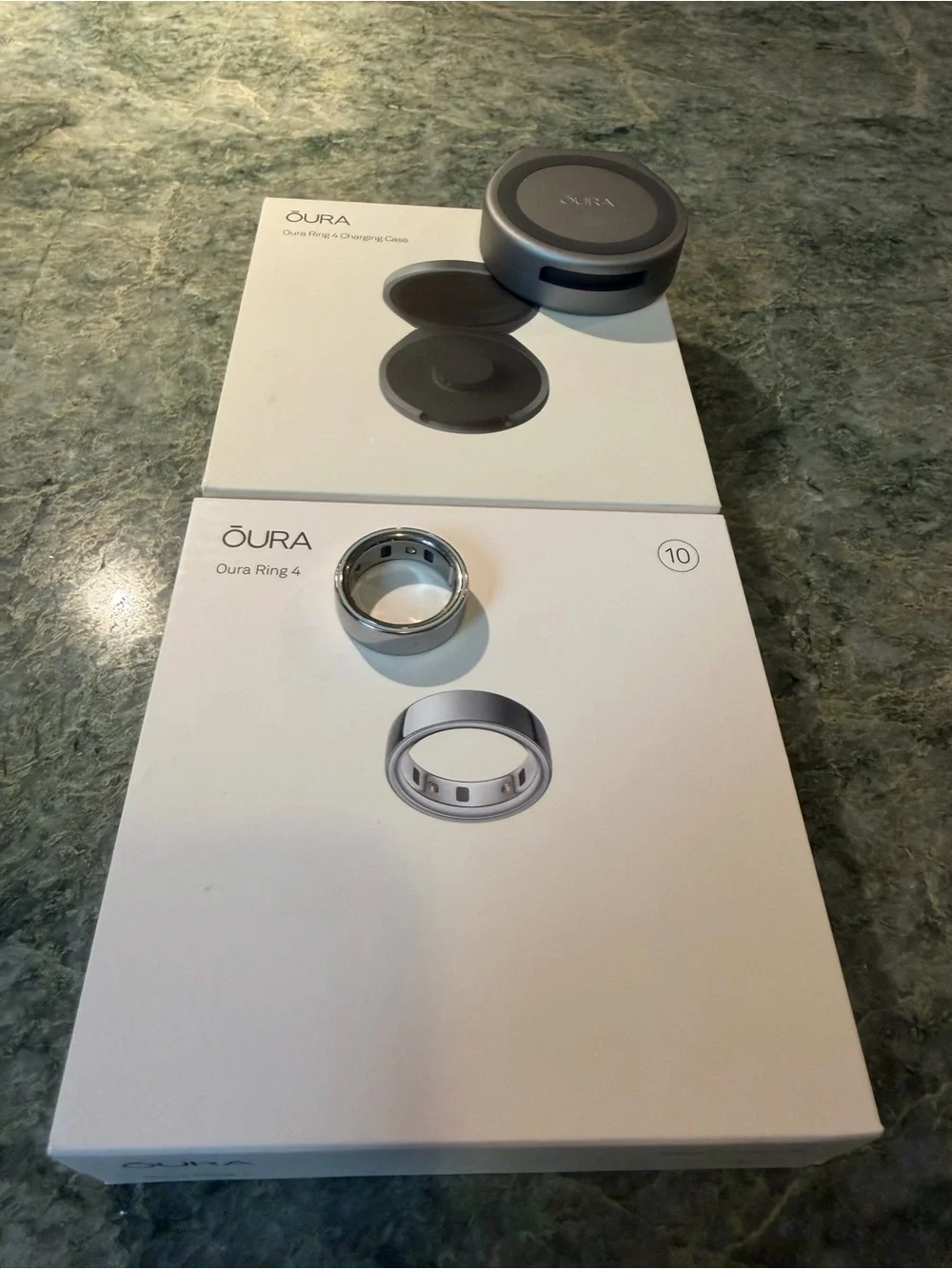 Oura ring 4 size 10 in silver with charging cord PLUS portable charging case.